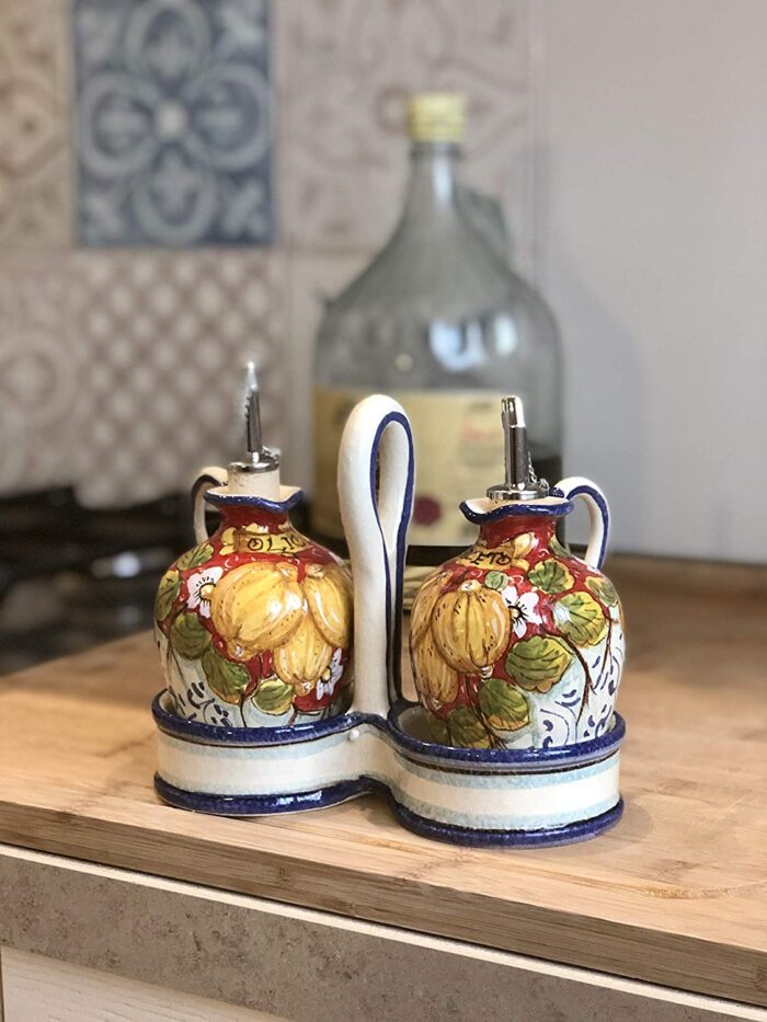 Cruet set oil and vinegar lemons background red - Image 3