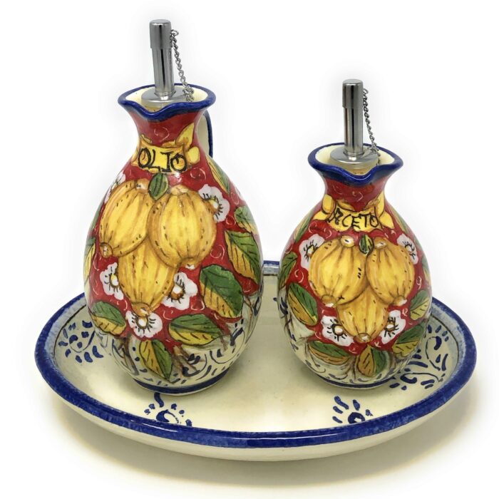 Cruet set oil and vinegar lemons background red - Image 2